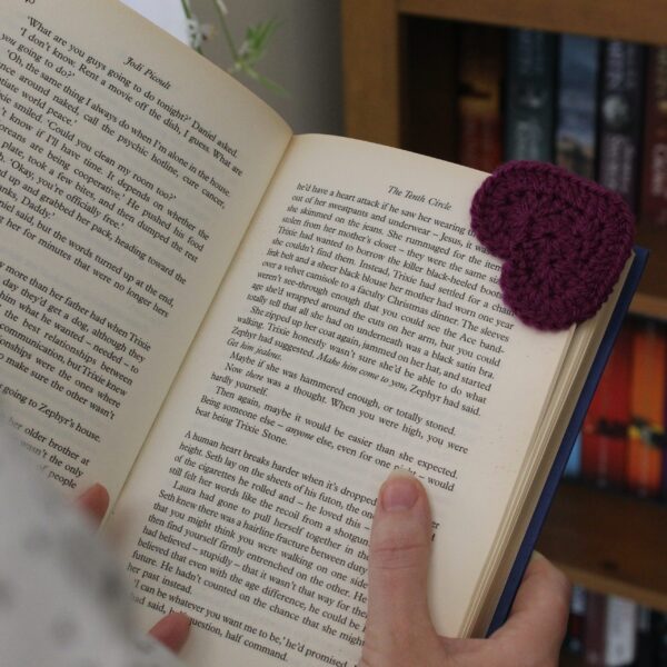 The perfect handcrafted stocking filler gift for any bookworm - a beautiful crocheted heart corner bookmark.