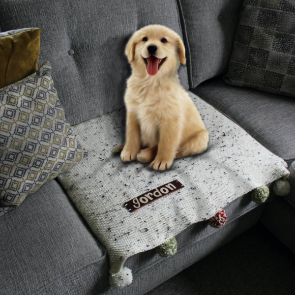 A handcrafted sofa saving pet pad or blanket featuring a thick, high quality personalised leather name tag and optional colour complimenting pompoms!