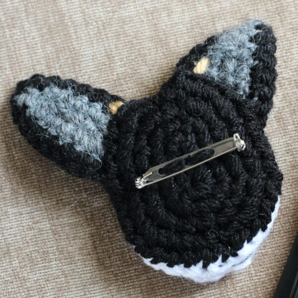 A personalised crocheted face of your pooch, created from your photographs and lovingly attached to a brooch pin.