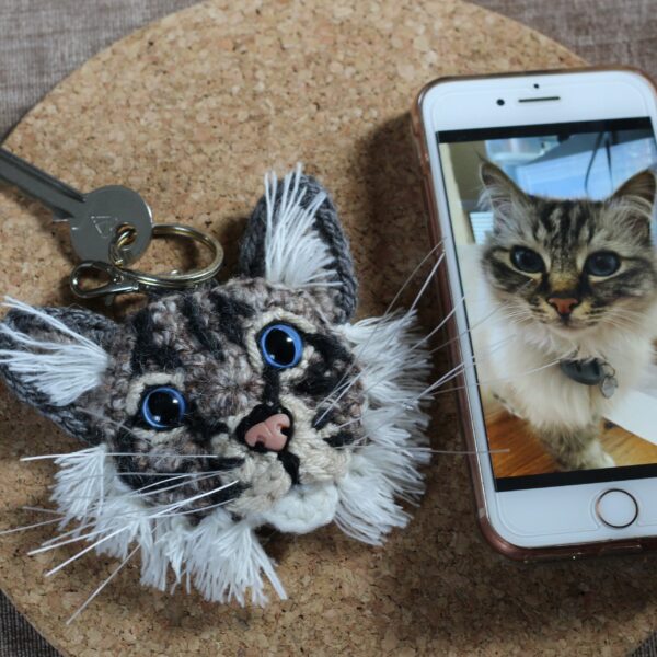 The perfect personalised letterbox gift for any cat parent - a crocheted replica of their best friend's face on a keyring, created from photographs.