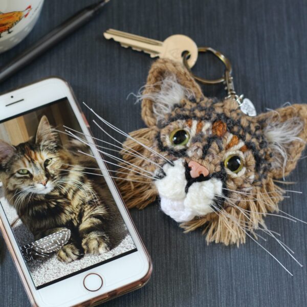 The perfect personalised letterbox gift for any cat parent - a crocheted replica of their best friend's face on a keyring, created from photographs.