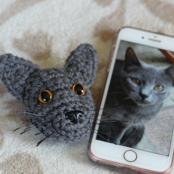 A personalised crocheted brooch with the face of your cat, created from your photographs and lovingly attached to a secure closing brooch pin.