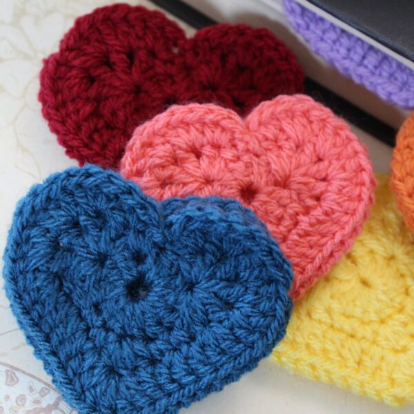 The perfect handcrafted stocking filler gift for any bookworm - a beautiful crocheted heart corner bookmark.