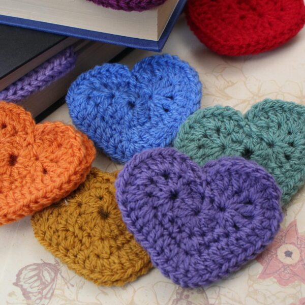 The perfect handcrafted stocking filler gift for any bookworm - a beautiful crocheted heart corner bookmark.