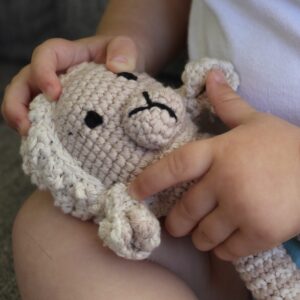 A beautifully handcrafted lamb baby rattle, the perfect gift for any little one.