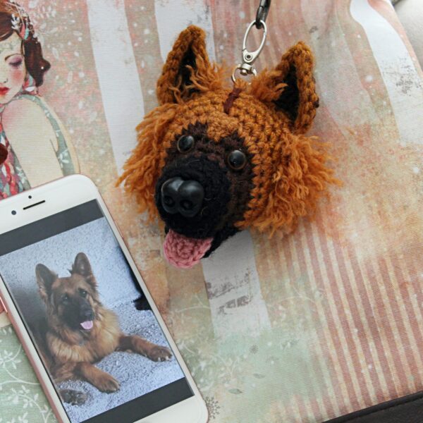 A personalised crochet soft toy head of your pooch created from photographs of your furry companion, lovingly attached to a hanging silver lobster clasp.