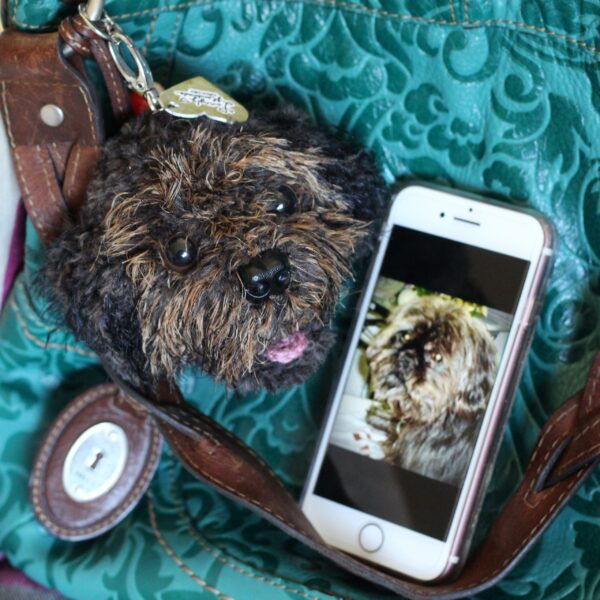 A personalised crochet soft toy head of your pooch created from photographs of your furry companion, lovingly attached to a hanging silver lobster clasp.