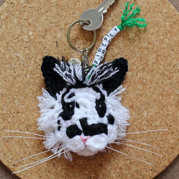 The perfect personalised gift for a small pet owner - a crocheted replica of their best friend's face, created from photographs, on a keyring.